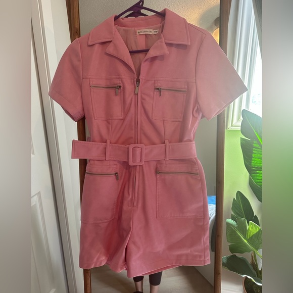 Light pink, very soft leather like material with a satin lining. EUC - Picture 1 of 3